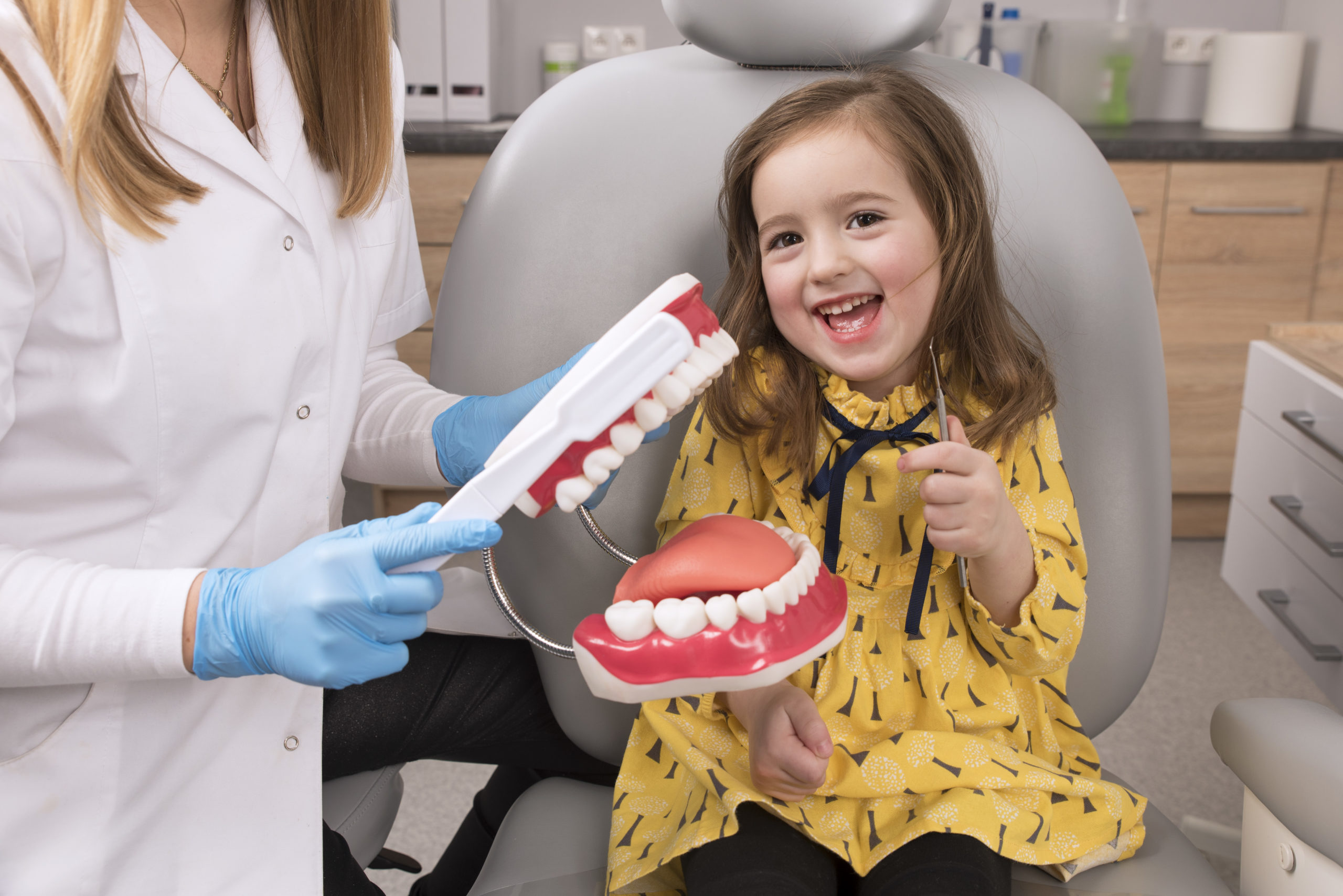 Dentist providing root canal treatment during an endodontic procedure